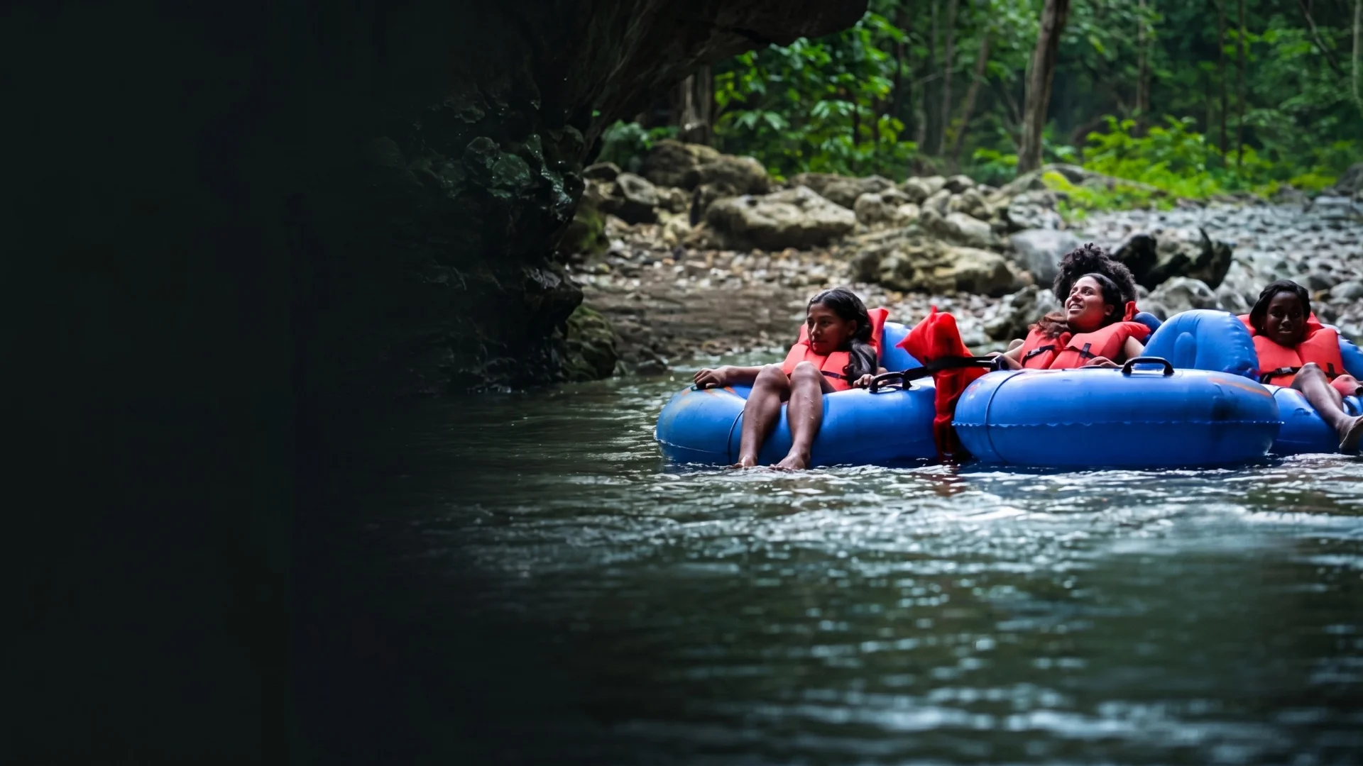 Group of cruise guests cave tubing in Belize